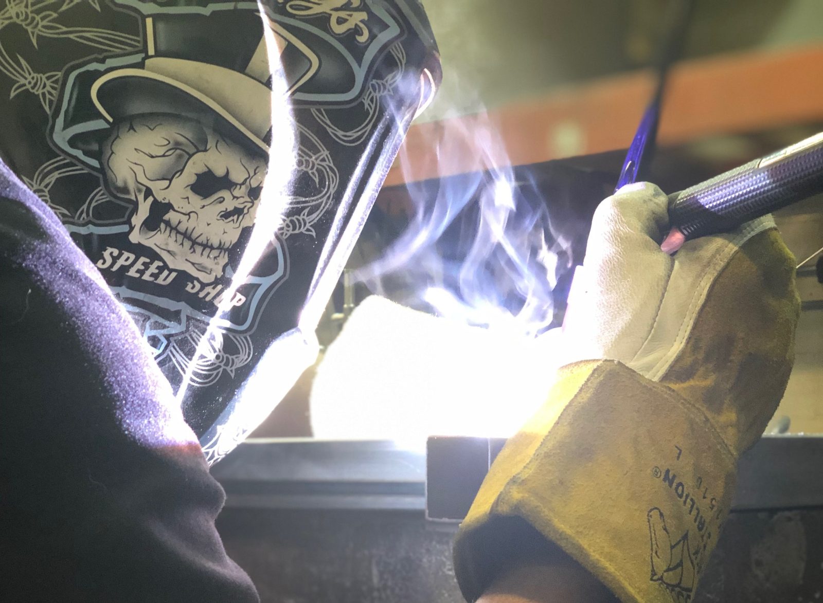 DiMasi fabricator welding custom steel, sparks and arc light